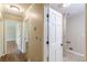 Hallway featuring hardwood floors, neutral paint and access to other rooms at 7928 S Giles Rd, Douglasville, GA 30135