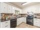 The kitchen has granite countertops, black appliances, and white cabinets, with brick tile backsplash at 7928 S Giles Rd, Douglasville, GA 30135