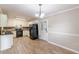 Well-equipped kitchen with tiled floors, black appliances, and ample counter space at 7928 S Giles Rd, Douglasville, GA 30135