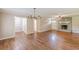 Spacious living room with hardwood floors, stone fireplace, ceiling fan, and ample natural light at 7928 S Giles Rd, Douglasville, GA 30135