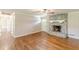 Spacious living room showcasing hardwood floors, a stone fireplace, and ample natural light at 7928 S Giles Rd, Douglasville, GA 30135