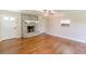 Bright living room features a stone fireplace and hardwood floors at 7928 S Giles Rd, Douglasville, GA 30135