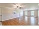 Open-concept living room featuring hardwood floors, neutral walls, and a ceiling fan at 7928 S Giles Rd, Douglasville, GA 30135