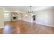 Bright living room with hardwood floors and a stone fireplace, creating a cozy atmosphere at 7928 S Giles Rd, Douglasville, GA 30135