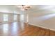 Open-concept living room with hardwood floors, neutral walls, and lots of natural light at 7928 S Giles Rd, Douglasville, GA 30135