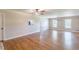 Open living room features hardwood floors and neutral paint scheme at 7928 S Giles Rd, Douglasville, GA 30135