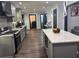 Spacious kitchen features a large central island, updated stainless steel appliances, and a neutral color palette at 1087 Yellow River Dr, Lawrenceville, GA 30043