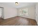 Well-lit bedroom showcasing stylish wood floors and ample natural light at 135 E Hill St # 22, Decatur, GA 30030