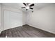 Bedroom with wood-look flooring, a closet and ceiling fan at 135 E Hill St # 22, Decatur, GA 30030