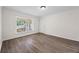 Comfortable bedroom with modern flooring and large window at 135 E Hill St # 22, Decatur, GA 30030