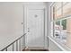Inviting doorway with white door, unit number 22, and sidelight window at 135 E Hill St # 22, Decatur, GA 30030
