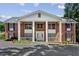 Inviting exterior with columns, brick facade, and well-maintained landscaping at 135 E Hill St # 22, Decatur, GA 30030