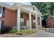 Stately brick building featuring tall white columns and ample parking at 135 E Hill St # 22, Decatur, GA 30030