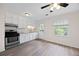 Updated kitchen featuring white cabinets, gray counters, stainless steel appliances and new wood-look floors at 135 E Hill St # 22, Decatur, GA 30030