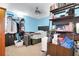 Bedroom featuring light blue walls, a ceiling fan, and a workspace with shelving at 403 Rustic Ridge Cir, Lawrenceville, GA 30043