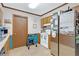 A tidy kitchen features stainless appliances, wood cabinets, and a refrigerator adorned with magnets and calendars at 403 Rustic Ridge Cir, Lawrenceville, GA 30043