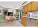 Kitchen with a breakfast nook and backyard views; features wood cabinets and stainless steel appliances at 403 Rustic Ridge Cir, Lawrenceville, GA 30043