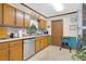 Kitchen featuring classic cabinetry, stainless steel dishwasher, and durable countertops at 403 Rustic Ridge Cir, Lawrenceville, GA 30043