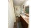 Bathroom with granite countertop vanity, decorative mirror and tiled floors at 4298 Hillview Dr, Acworth, GA 30101