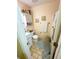 Cozy bathroom featuring tiled floors, a white vanity, toilet, and cabinet at 4298 Hillview Dr, Acworth, GA 30101
