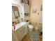 Cozy bathroom featuring a modern sink and vanity, a toilet, and decorative elements at 4298 Hillview Dr, Acworth, GA 30101