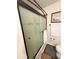 Bathroom featuring decorative glass shower doors and updated fixtures at 4298 Hillview Dr, Acworth, GA 30101