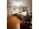 Spacious bedroom with wooden floors, ceiling fan and a large comfortable bed at 4298 Hillview Dr, Acworth, GA 30101