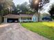 Charming single-Gathering home boasts a lush front lawn, attached garage, and a welcoming front porch at 4298 Hillview Dr, Acworth, GA 30101