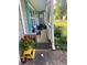 View of home's cozy front porch, featuring comfortable seating and vibrant potted plants at 4298 Hillview Dr, Acworth, GA 30101