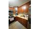 Kitchen with stainless steel appliances, cream countertops and ample storage at 4298 Hillview Dr, Acworth, GA 30101