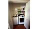 Conveniently located laundry area with washer and dryer; storage shelves above machines add functionality at 4298 Hillview Dr, Acworth, GA 30101