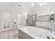 Luxurious bathroom with soaking tub, walk-in shower, and double vanities at 515 Old Chartwell Xing, Alpharetta, GA 30022