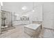 Beautiful bathroom featuring walk-in shower, soaking tub, and double vanity sinks at 515 Old Chartwell Xing, Alpharetta, GA 30022