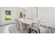 Elegant dining room featuring a marble table, comfortable seating, and natural light at 515 Old Chartwell Xing, Alpharetta, GA 30022