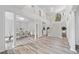 Spacious foyer with staircase and grand columns leads to the living and dining areas at 515 Old Chartwell Xing, Alpharetta, GA 30022