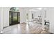 Spacious foyer leading to the dining room, with decorative columns and hardwood flooring at 515 Old Chartwell Xing, Alpharetta, GA 30022