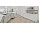 Modern kitchen with stainless steel appliances, granite countertops, and a breakfast bar at 515 Old Chartwell Xing, Alpharetta, GA 30022