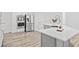Bright kitchen boasts stainless steel appliances and a gray island with white countertop at 515 Old Chartwell Xing, Alpharetta, GA 30022