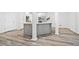 Modern kitchen island with a stainless steel sink and pendant lighting, perfect for gatherings at 515 Old Chartwell Xing, Alpharetta, GA 30022