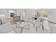 Spacious living room with an open layout, connecting to the kitchen and dining areas for easy entertaining at 515 Old Chartwell Xing, Alpharetta, GA 30022