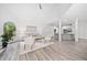 Open-concept living area with vaulted ceilings, and views of the landscaped exterior at 515 Old Chartwell Xing, Alpharetta, GA 30022