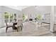 Elegant living room features arched windows, a fireplace, and comfortable seating at 515 Old Chartwell Xing, Alpharetta, GA 30022