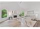 Cozy living room with a fireplace and arched windows, enhancing the bright and airy atmosphere at 515 Old Chartwell Xing, Alpharetta, GA 30022