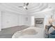 Spacious main bedroom with tray ceilings, fireplace, and neutral colors at 515 Old Chartwell Xing, Alpharetta, GA 30022