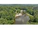 Scenic aerial shot of a lake with a sandy beach and community amenities at 890 Lake Dr, Snellville, GA 30039