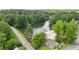 Aerial image of lake featuring a beach, docks, and lush green surroundings at 890 Lake Dr, Snellville, GA 30039