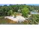 Community lake's sandy beach featuring sun loungers and a swim platform with a slide at 890 Lake Dr, Snellville, GA 30039