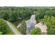 Aerial of lake, showcasing a sandy beach area and boat docks for waterfront living at 890 Lake Dr, Snellville, GA 30039
