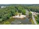 Aerial view of a community lake with a sandy beach and boat docks at 890 Lake Dr, Snellville, GA 30039