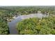 Aerial view of a lakefront community surrounded by lush trees at 890 Lake Dr, Snellville, GA 30039